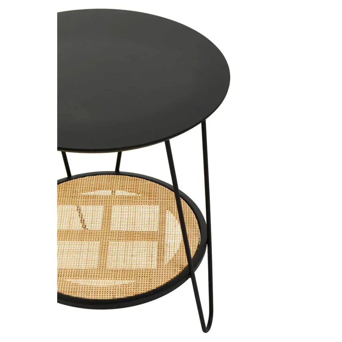 Black metal side table with rattan shelf and slim legs, close view of tabletop and shelf