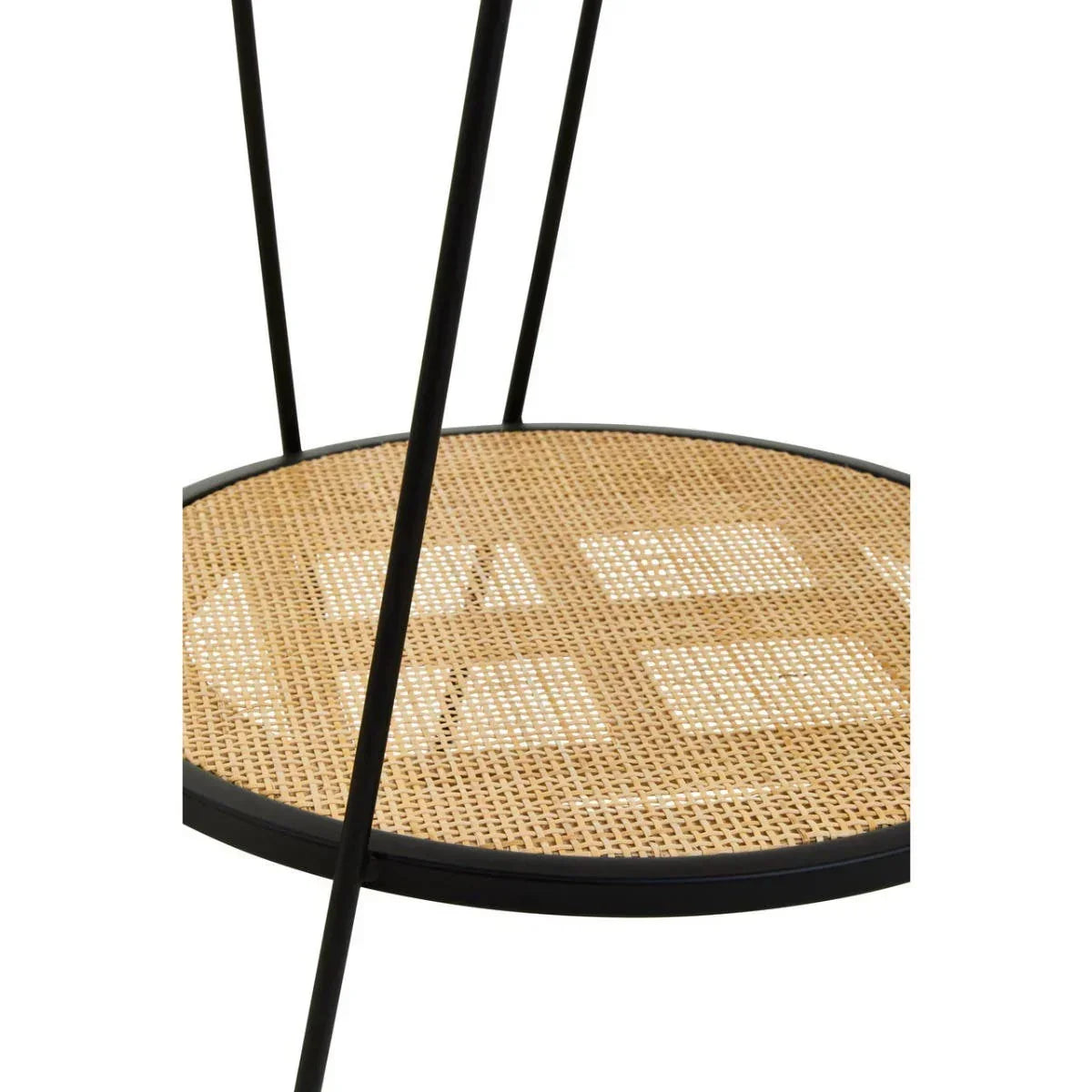 Round side table with black metal legs and woven rattan shelf detail