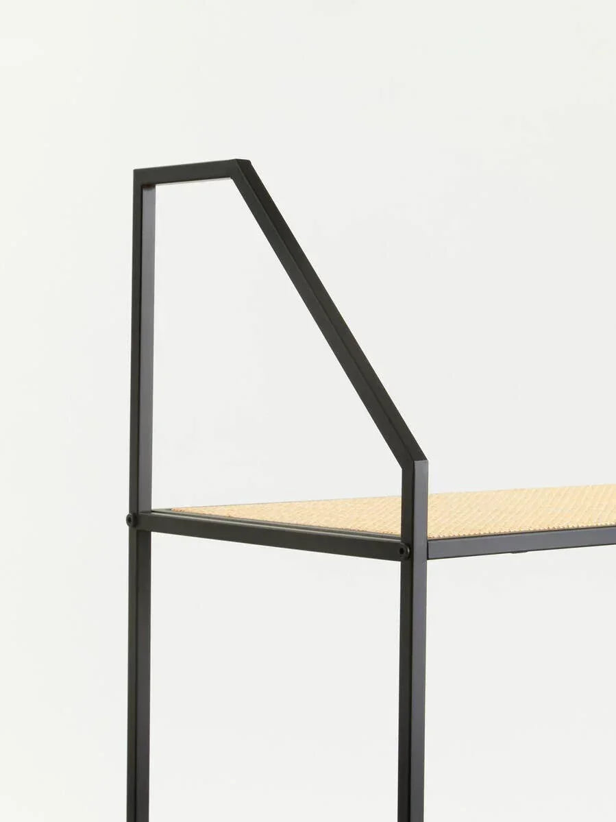 Close-up of black metal frame shelf with light wood surface and modern angular design