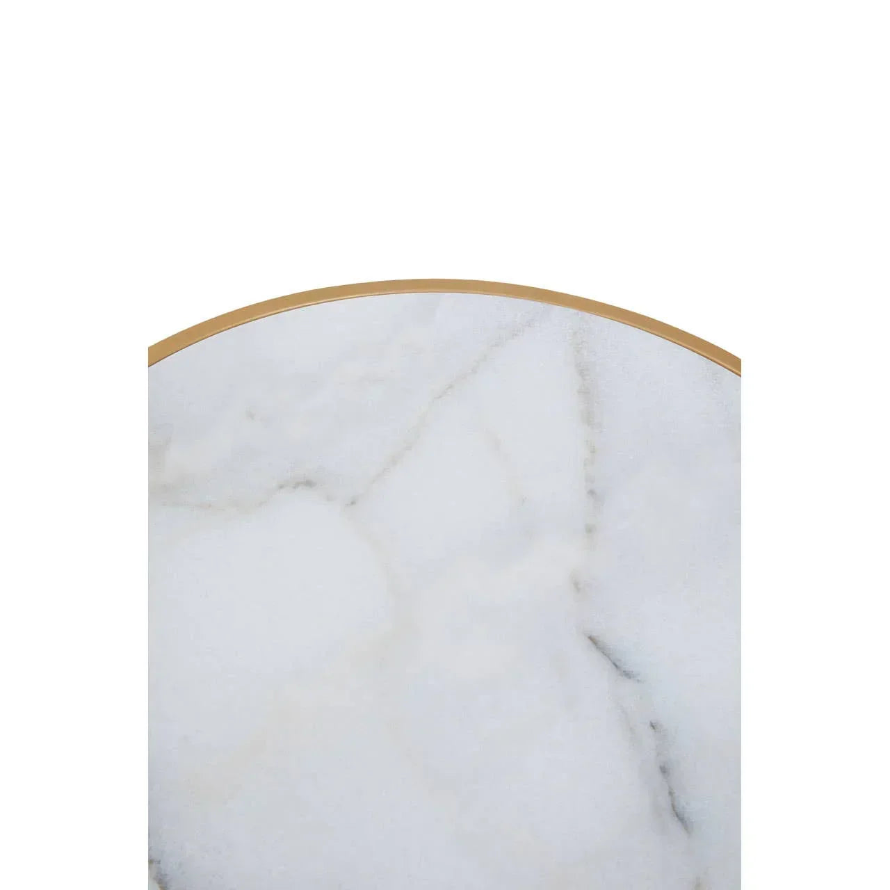 White marble tabletop with rounded gold metal edge, closeup view