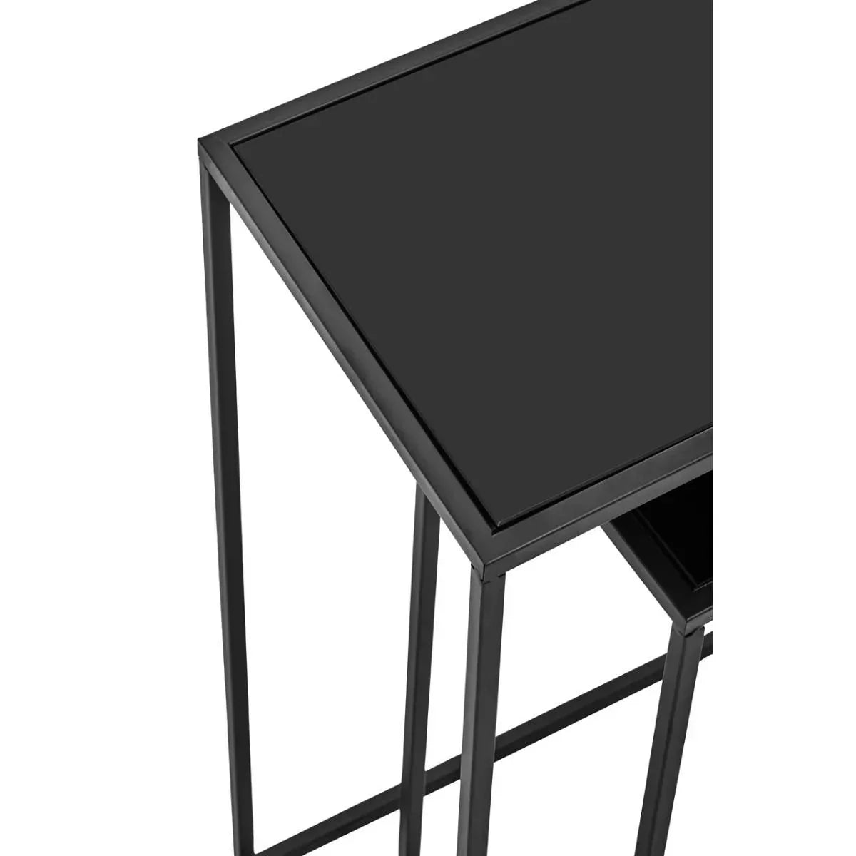 Square black metal nesting side table with glass top, close-up of corner and frame
