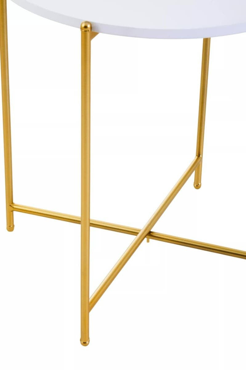 Round white tabletop supported by a sleek gold metal frame with crossed legs, showcasing a modern and elegant design suitable for home decor