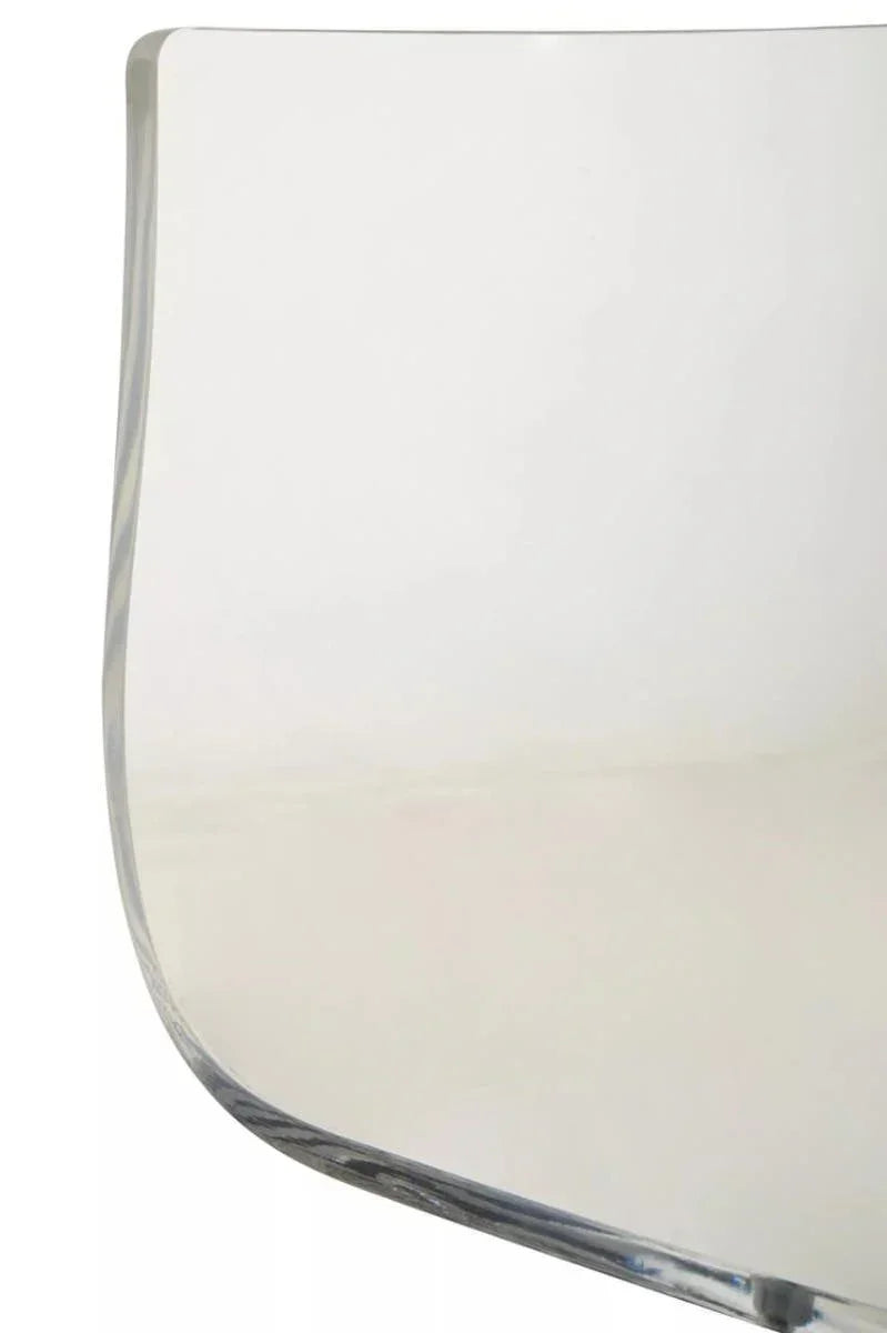 Curved edge clear glass tabletop close-up showing smooth, rounded design