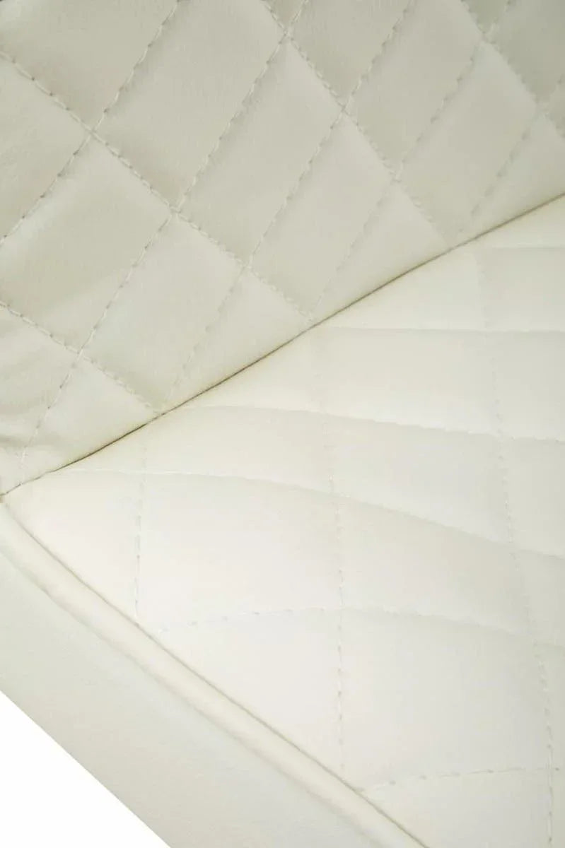 Closeup of cream leather sofa seat with diamond quilted stitching detail