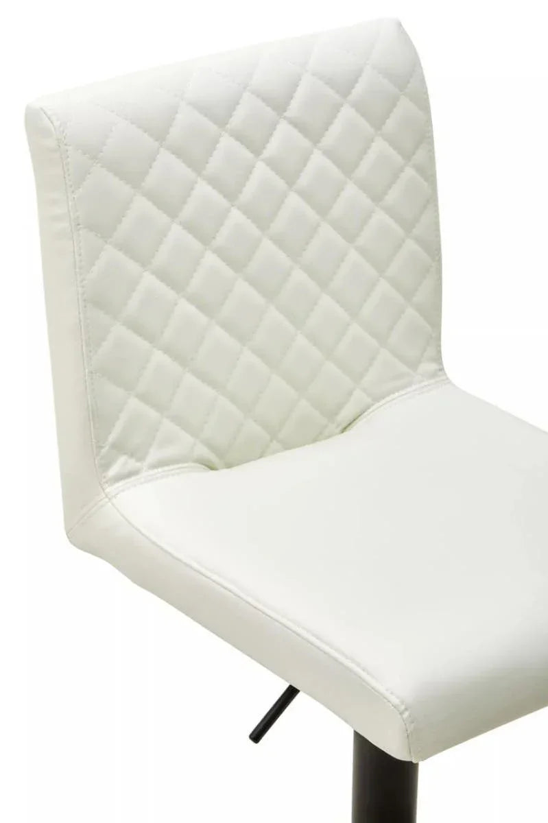 White faux leather bar stool with quilted backrest and black metal base, side angle view