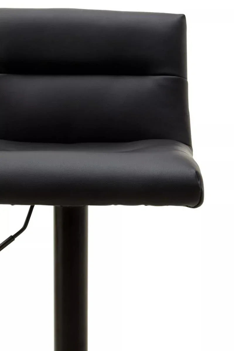 Close-up of black faux leather bar stool with padded seat and backrest