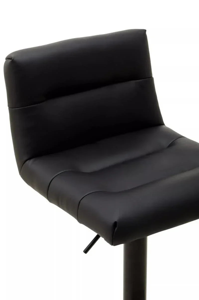 Black faux leather bar stool with padded seat and backrest, side angle view