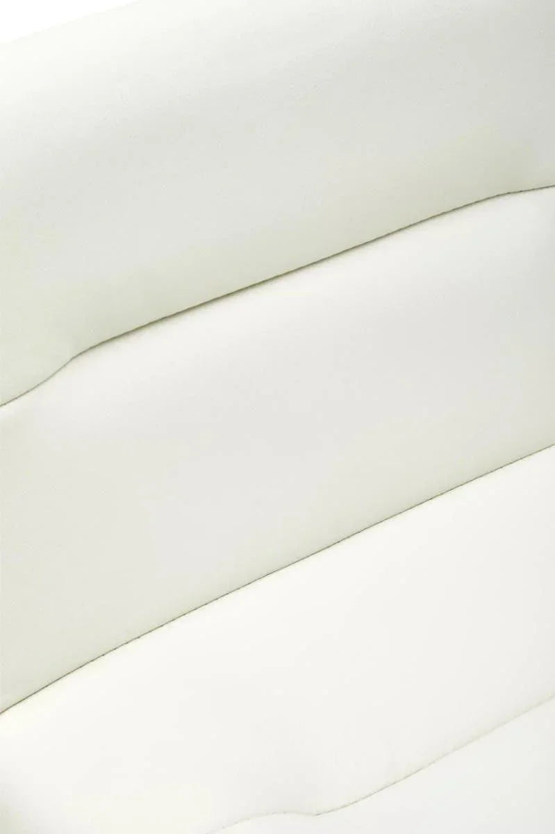 Close view of cream faux leather sofa backrest with horizontal stitched detailing