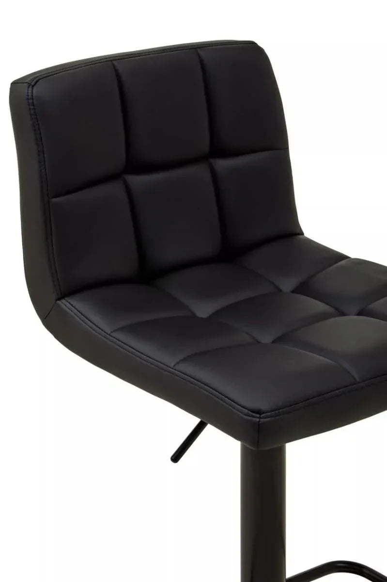 Black faux leather bar stool with grid-stitched seat and backrest, partial side view
