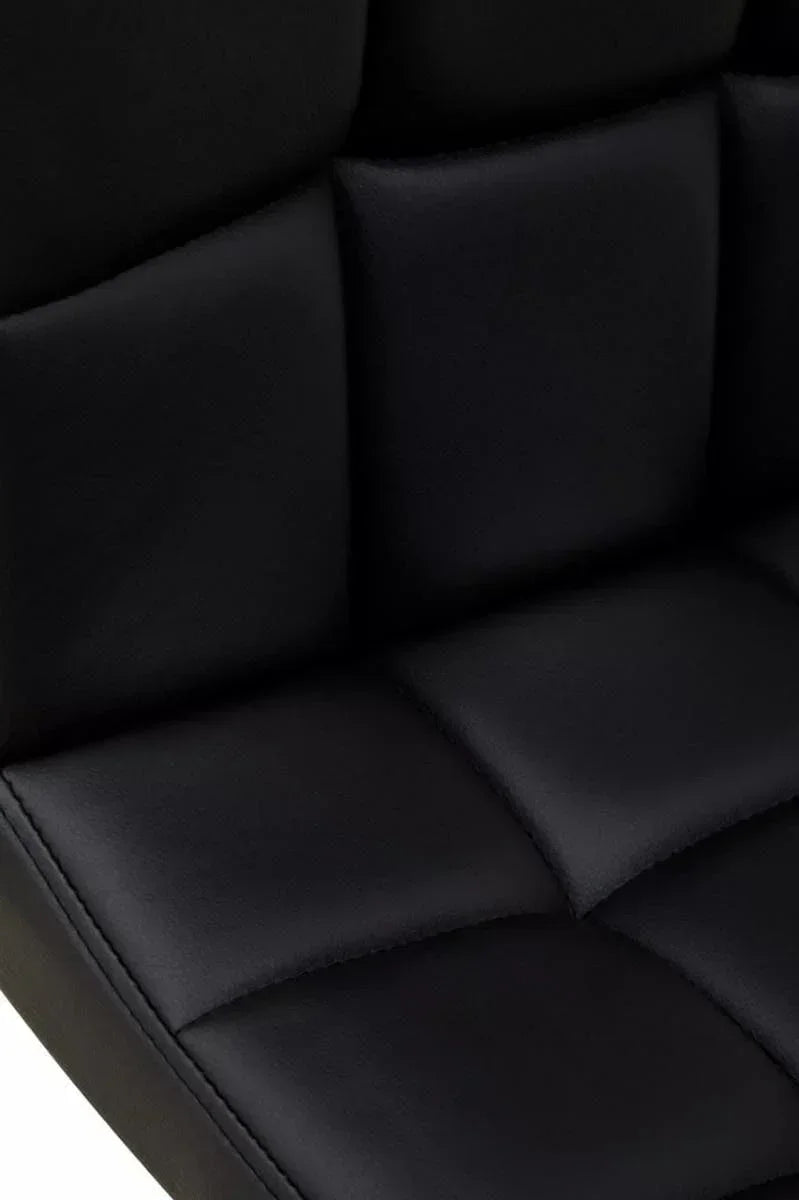 Black faux leather chair with square stitched cushioned seat and backrest close-up