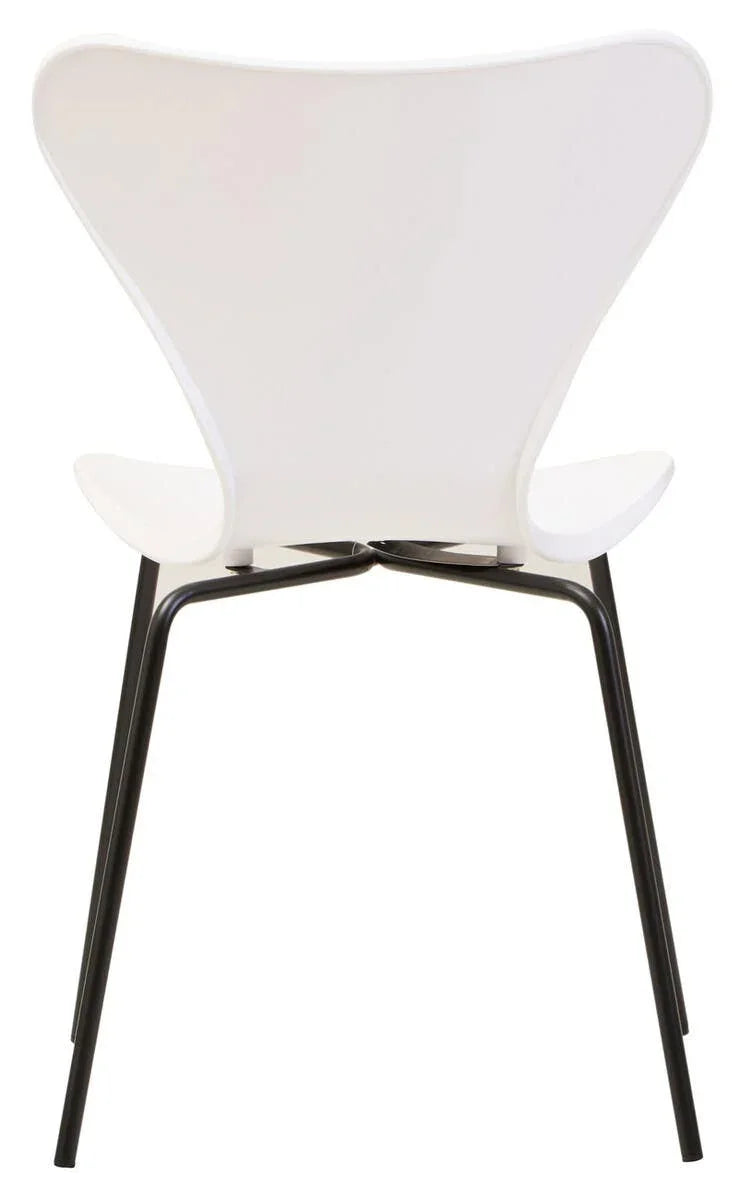White modern dining chair with curved seat and black metal legs, rear view