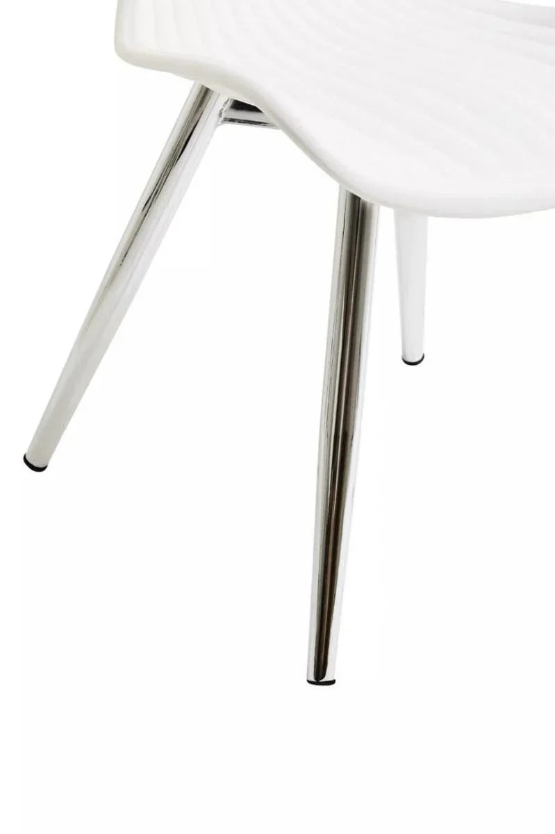 White plastic dining chair with chrome legs, close view of seat and angled legs