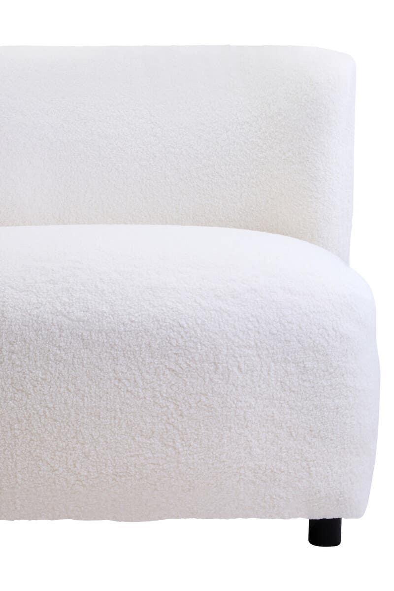 White boucle sofa corner with curved backrest and textured upholstery