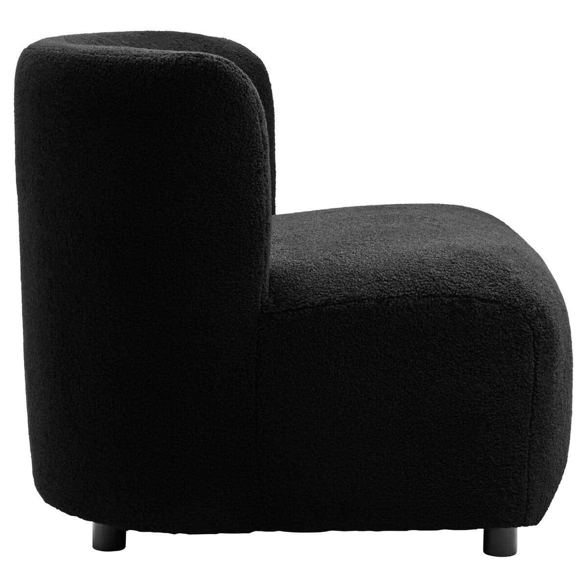 Side view of black boucle accent chair with rounded back and plush upholstery