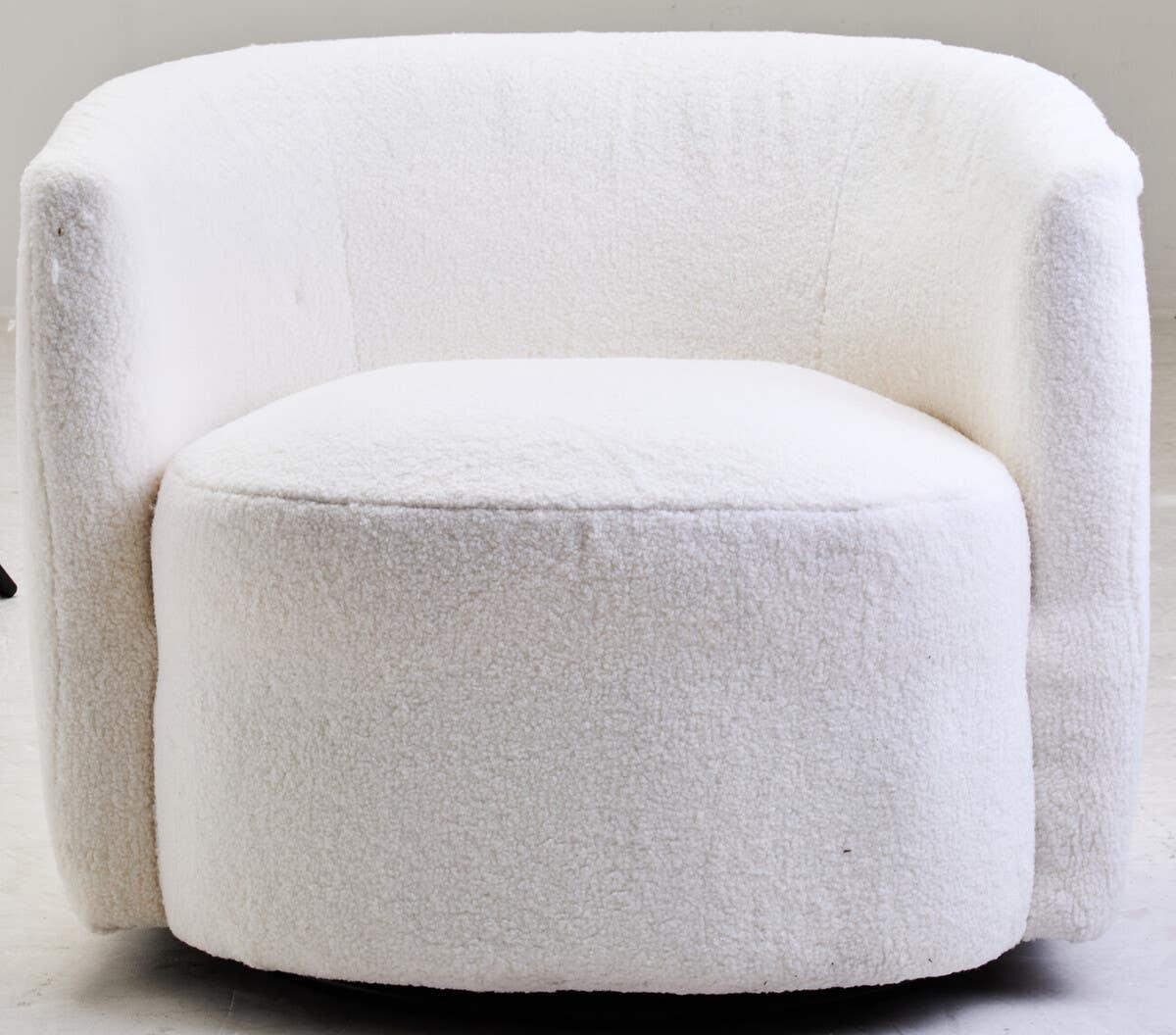 White boucle accent chair with rounded backrest and plush seat