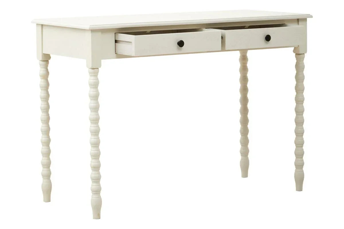 White wooden desk with turned legs and two drawers, one drawer partially open