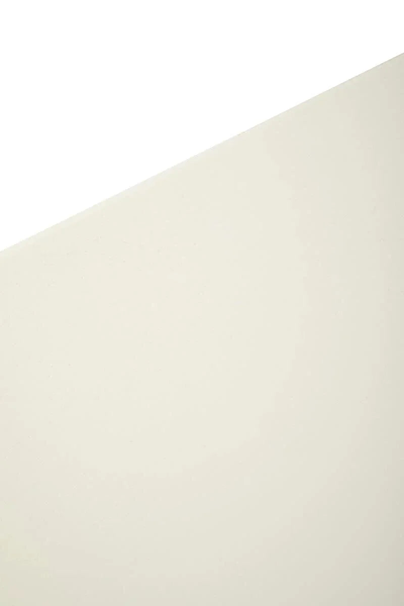 Closeup of cream dining table top with smooth finish