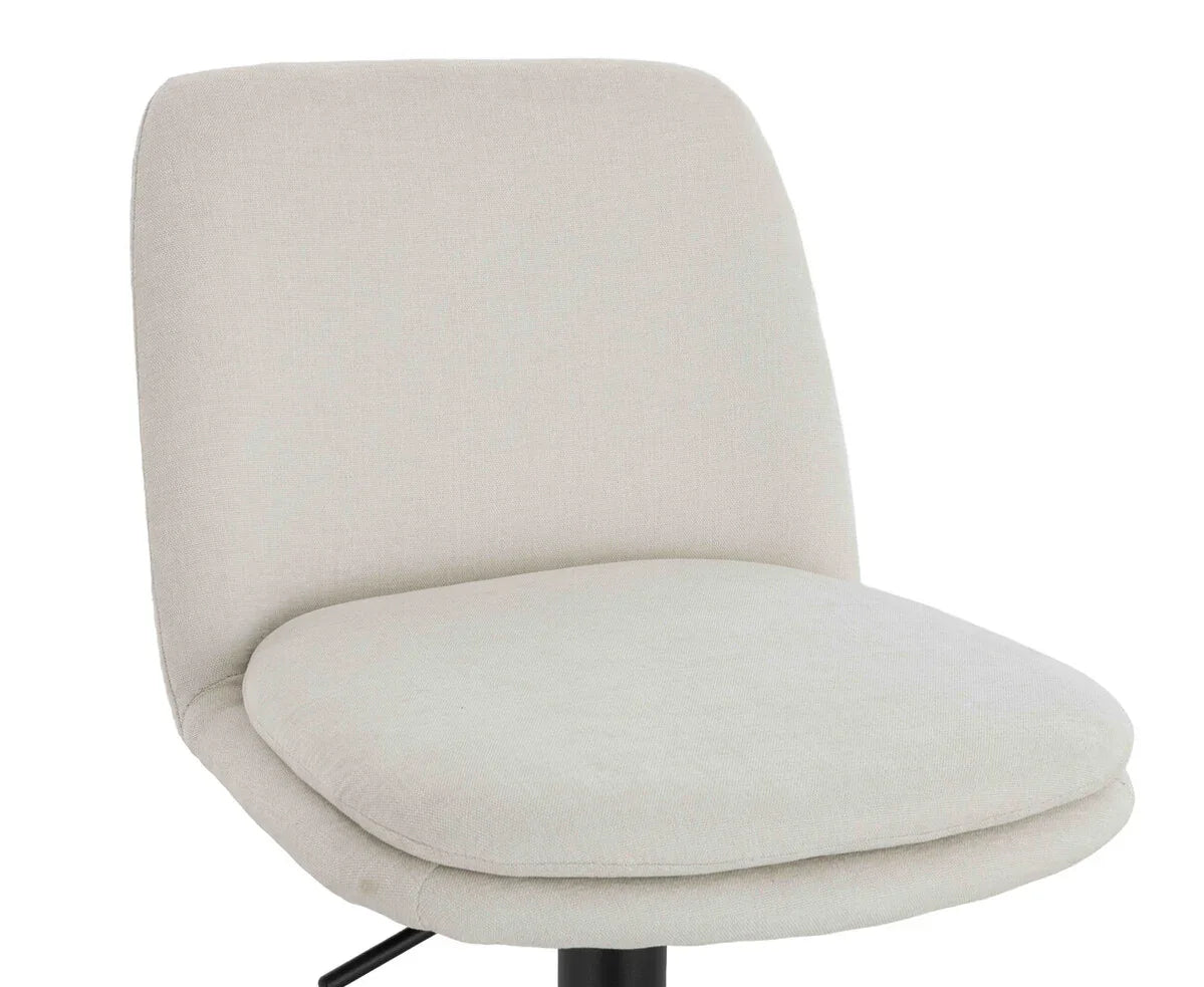 Beige fabric dining chair with cushioned seat and backrest, partial side angle view