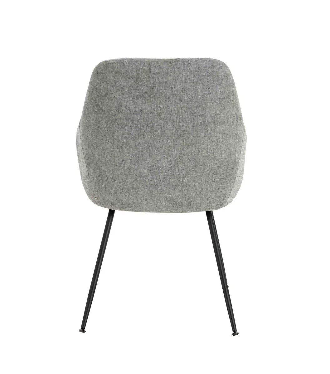 Rear view of grey fabric dining chair with black tapered metal legs
