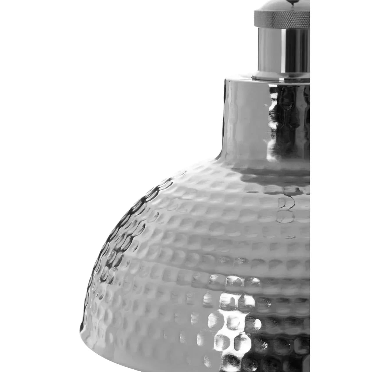 Close-up of hammered metal pendant light shade with textured chrome finish