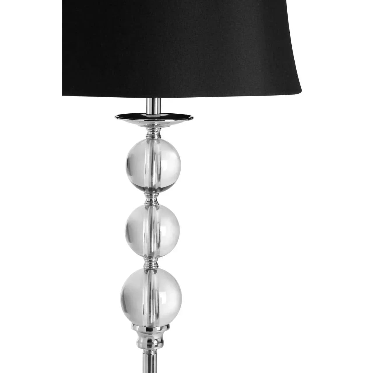 Modern table lamp with black shade and chrome base featuring glass globe accents