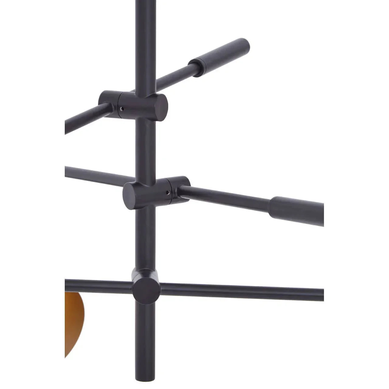 Black metal frame detail of modern furniture with intersecting rods and smooth finish