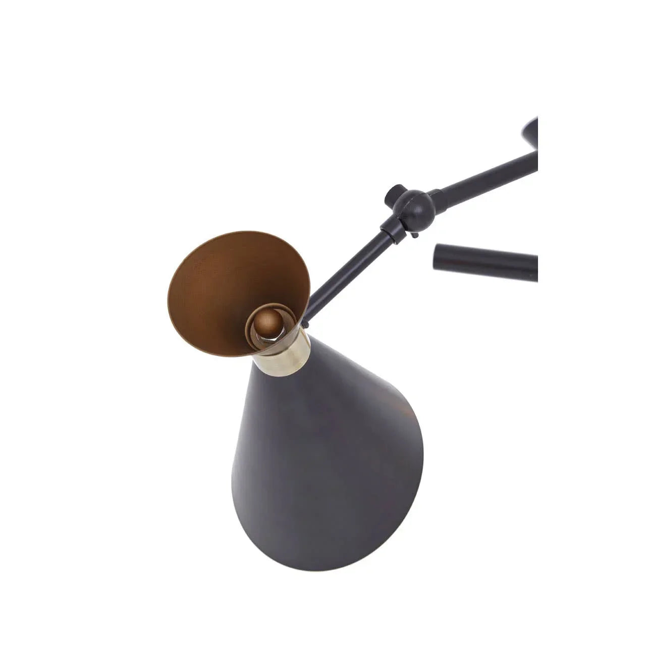 Black metal desk lamp with adjustable arm and gold cone shade, close-up view