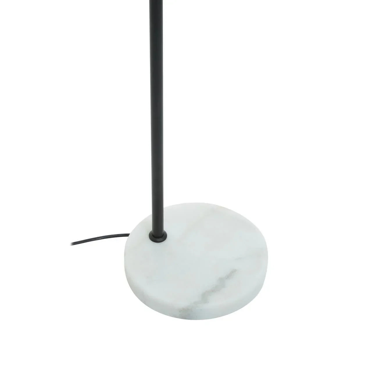 Round white marble lamp base with black metal stand and visible power cord