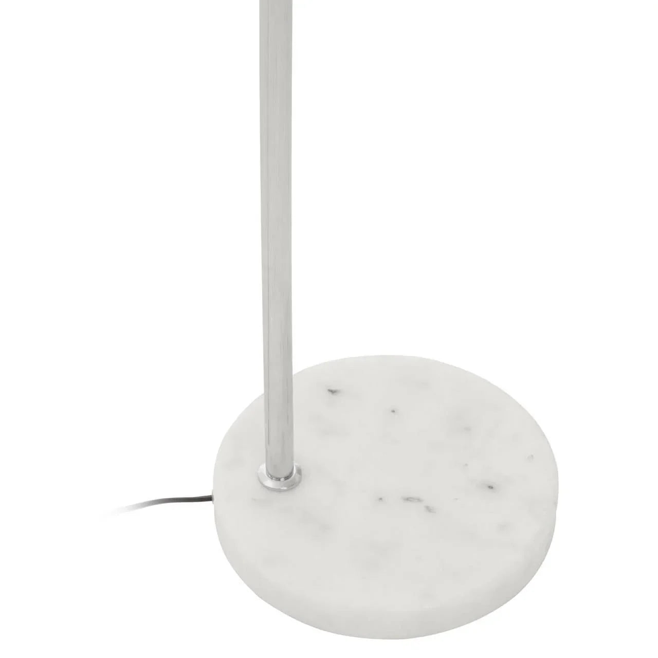 Floor lamp with chrome pole and round white marble base, close-up view