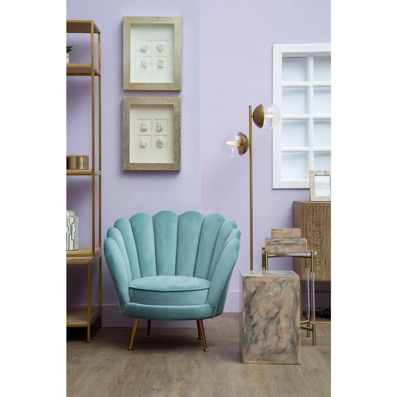 Velvet scallop accent chair in teal with gold legs in modern living room setting