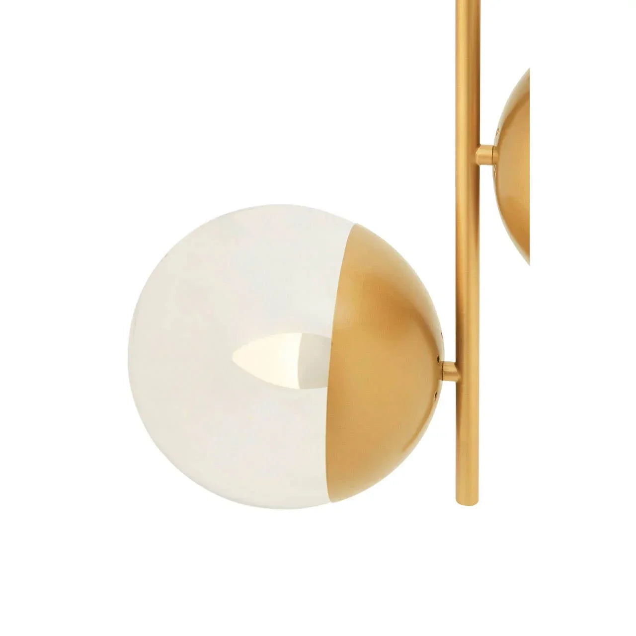 Gold and glass globe wall light with modern brass finish and vertical rod