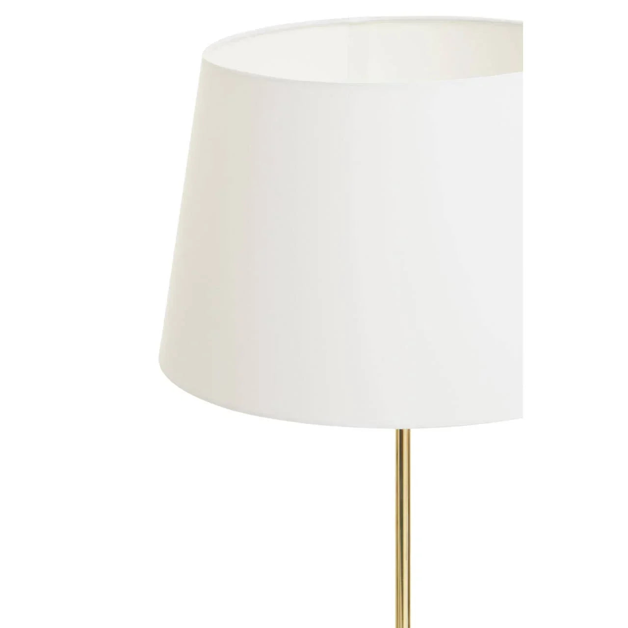 White drum lamp shade with gold metal lamp stand close-up
