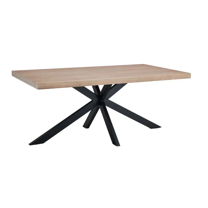 Rectangular wooden dining table with black metal star-shaped legs