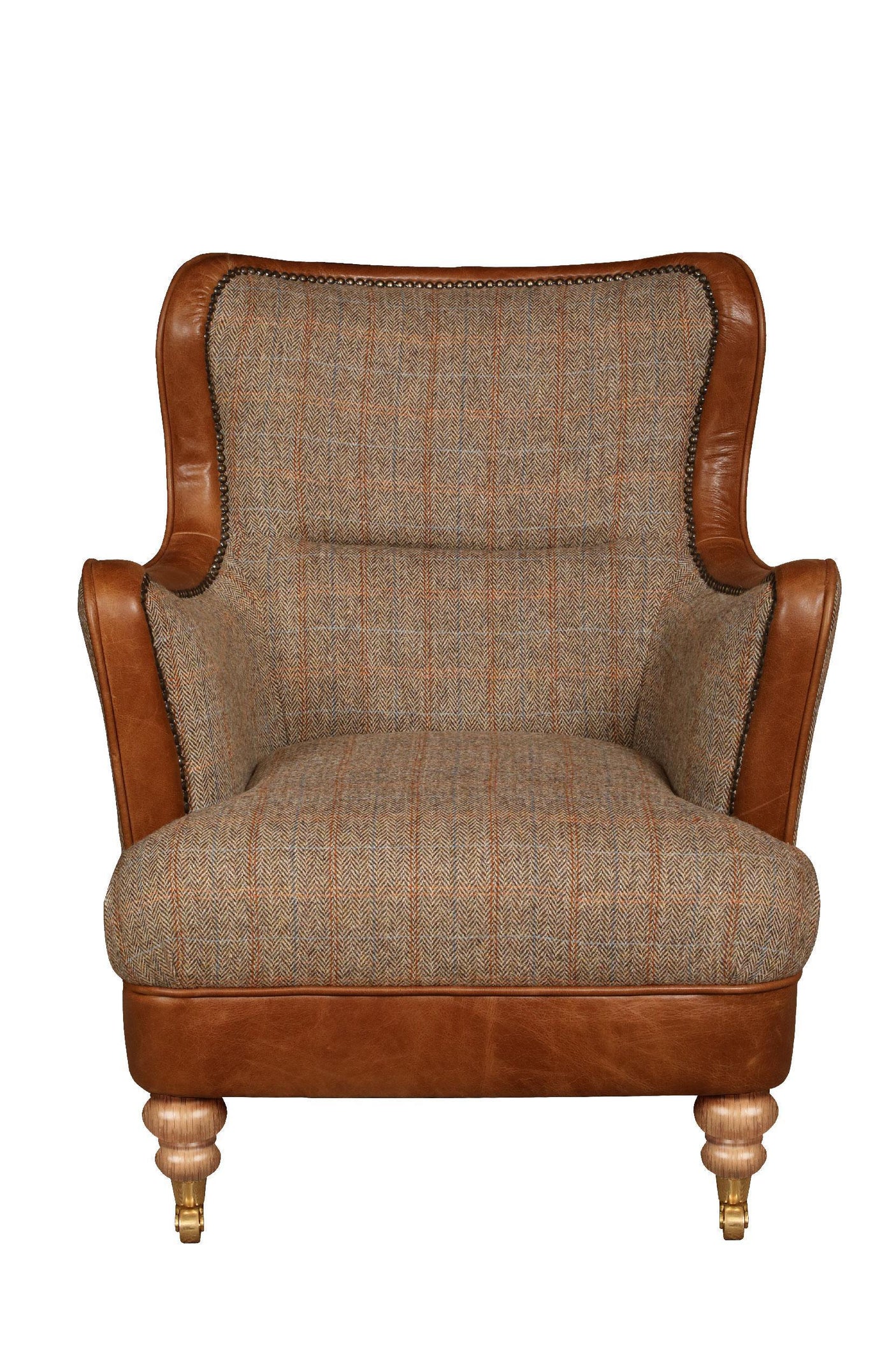 Brown leather and plaid fabric armchair with wooden legs and brass castors front view