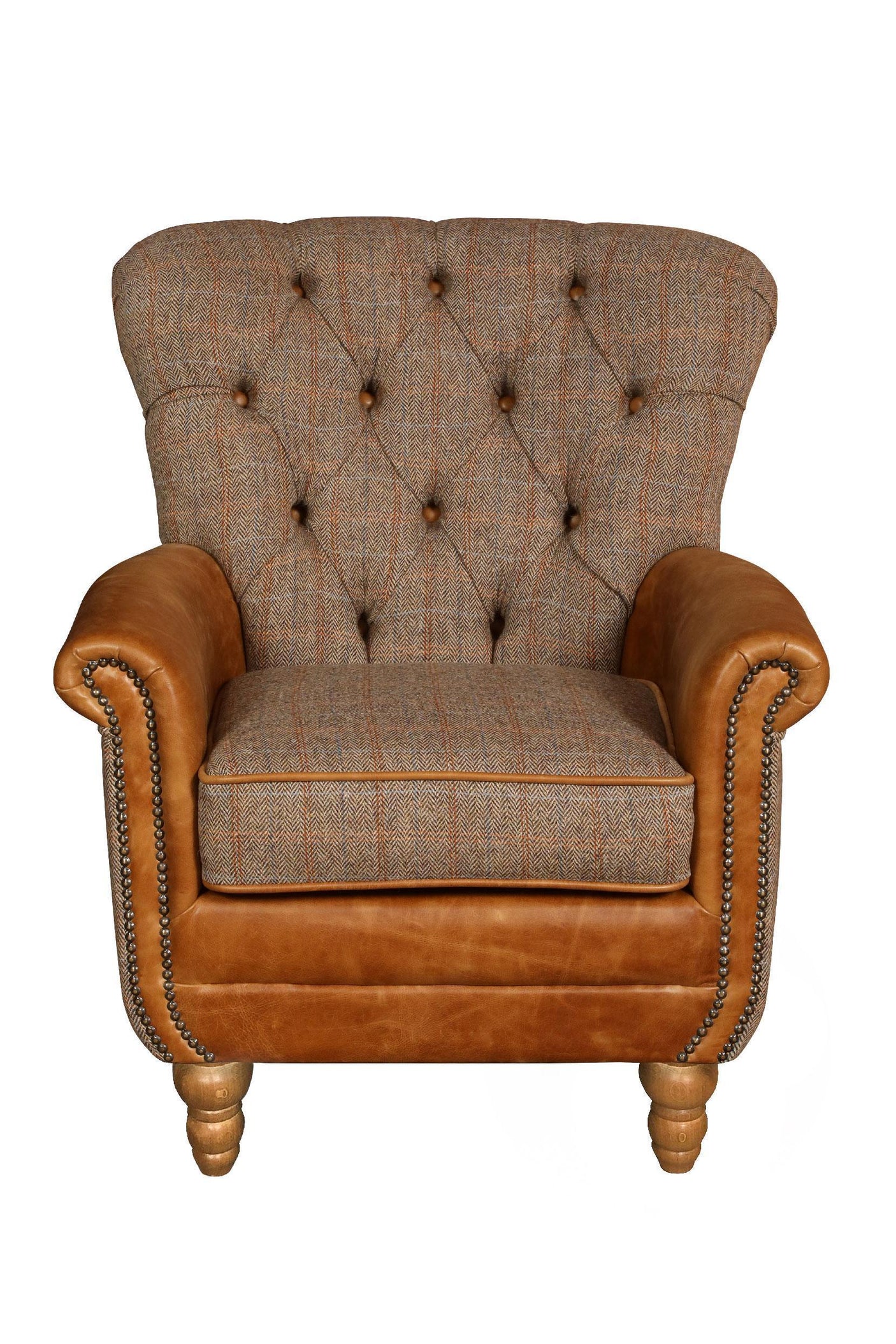 Button-tufted fabric armchair with brown leather arms and wooden legs, front view
