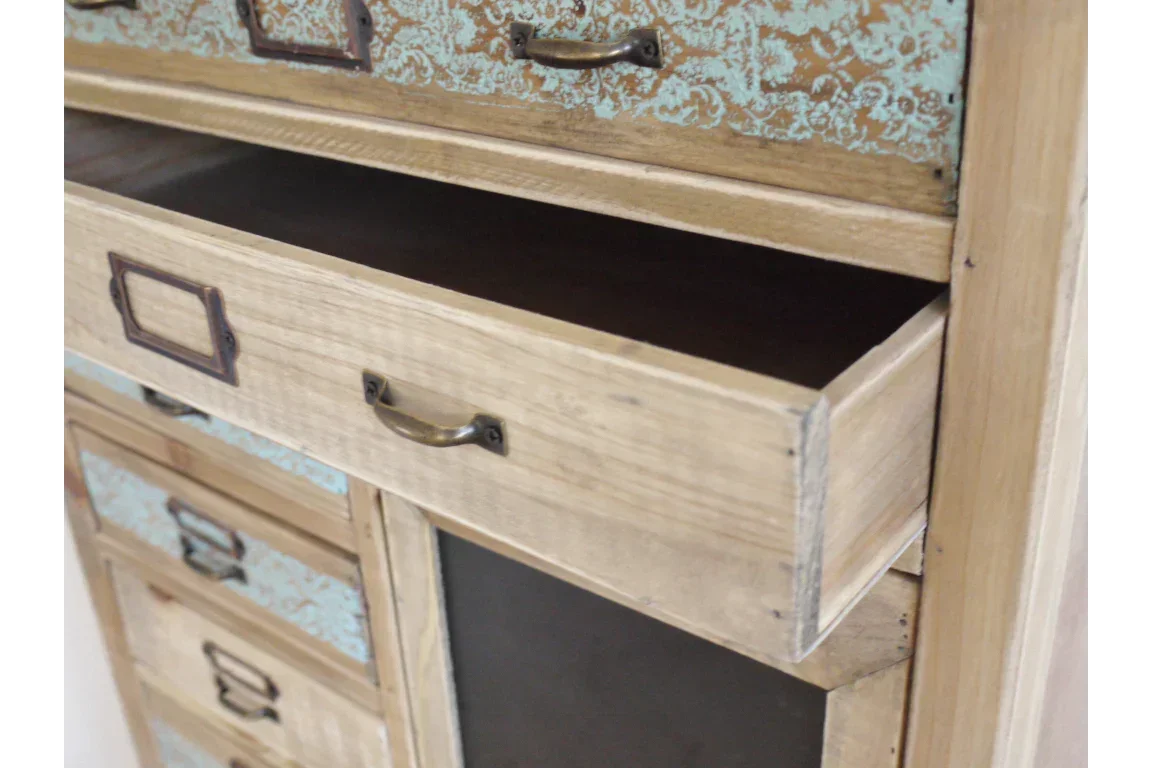 Wooden chest of drawers with open drawer and blue patterned drawer fronts