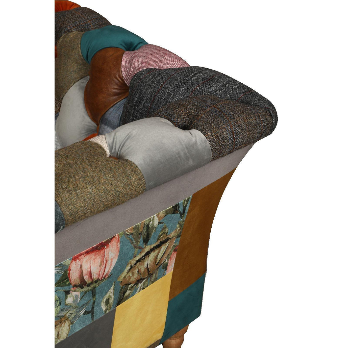 Patchwork fabric sofa armrest close-up with mixed textures and floral panel
