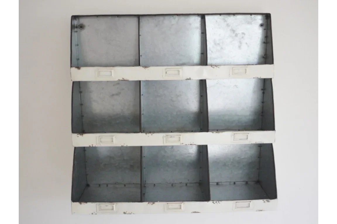 Metal wall storage unit with nine cubbies and white frame