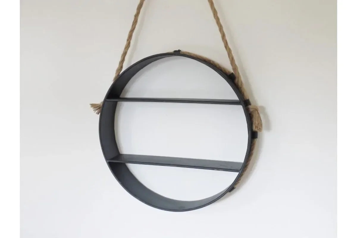 Round metal wall shelf with rope hanger and two shelves against white wall