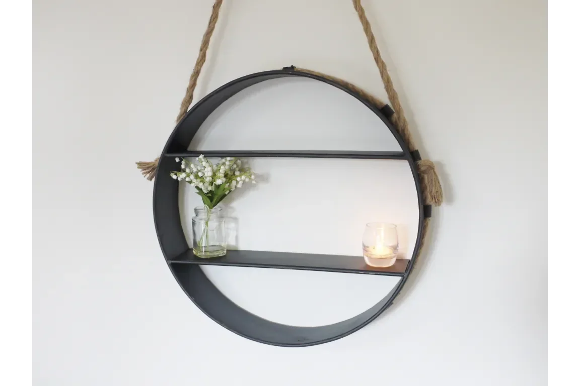 Round metal wall shelf with rope hanging, glass vase and candle on display