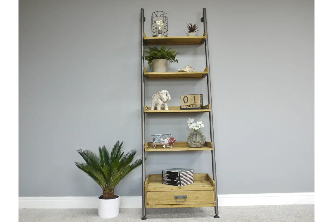 Industrial ladder bookshelf with wooden shelves and drawer, styled with plants and decor