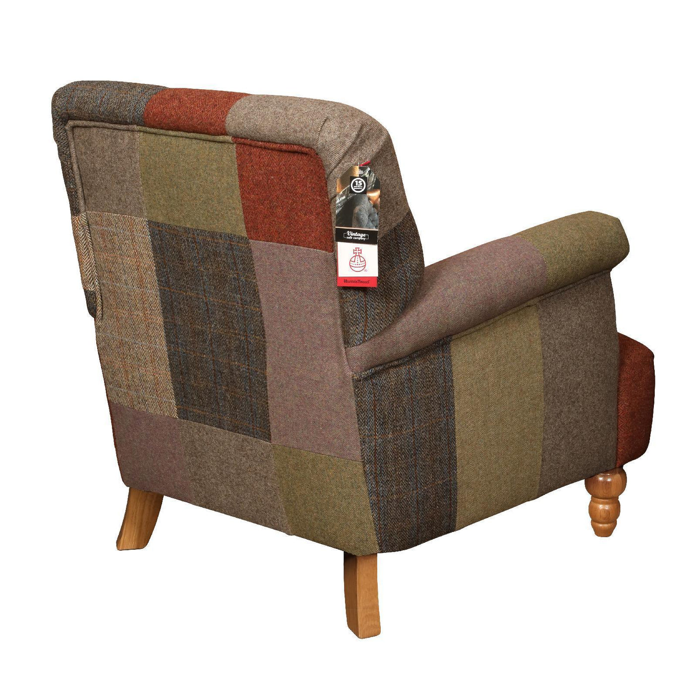Patchwork armchair with multi-colored fabric and wooden legs, rear angled view