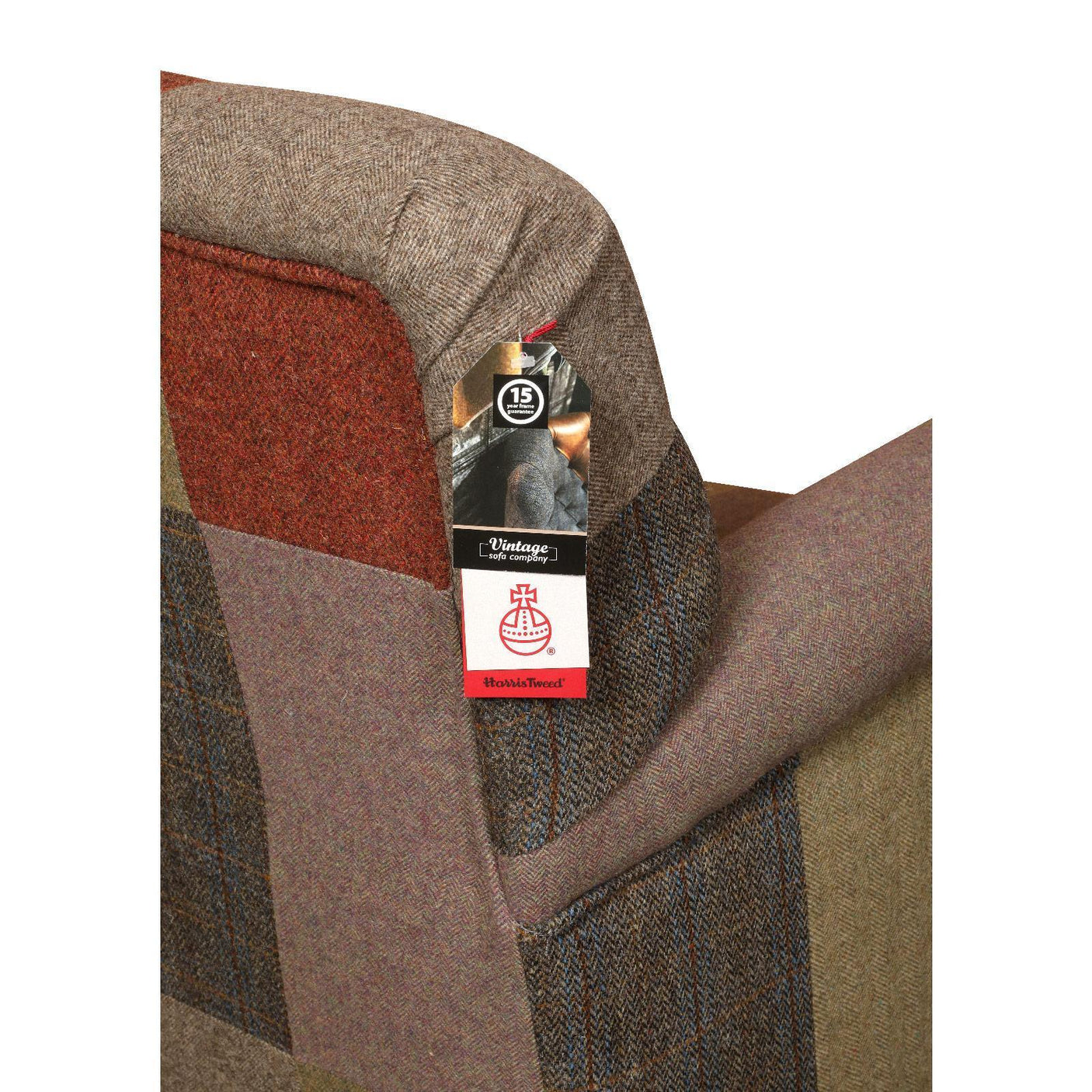 Patchwork tweed fabric armchair backrest closeup with vintage style upholstery tag