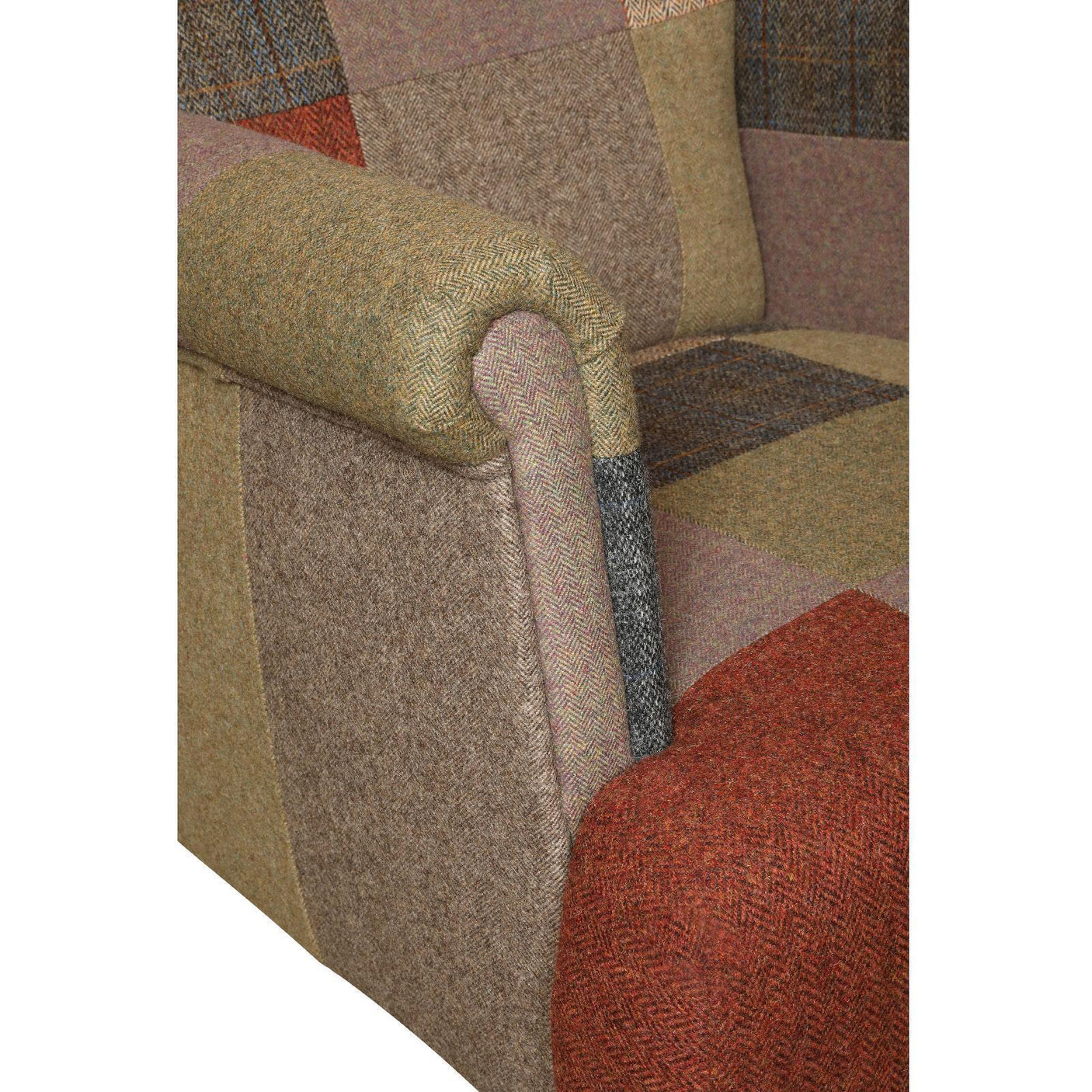 Patchwork fabric armchair close-up showing rolled armrest and wool blend upholstery