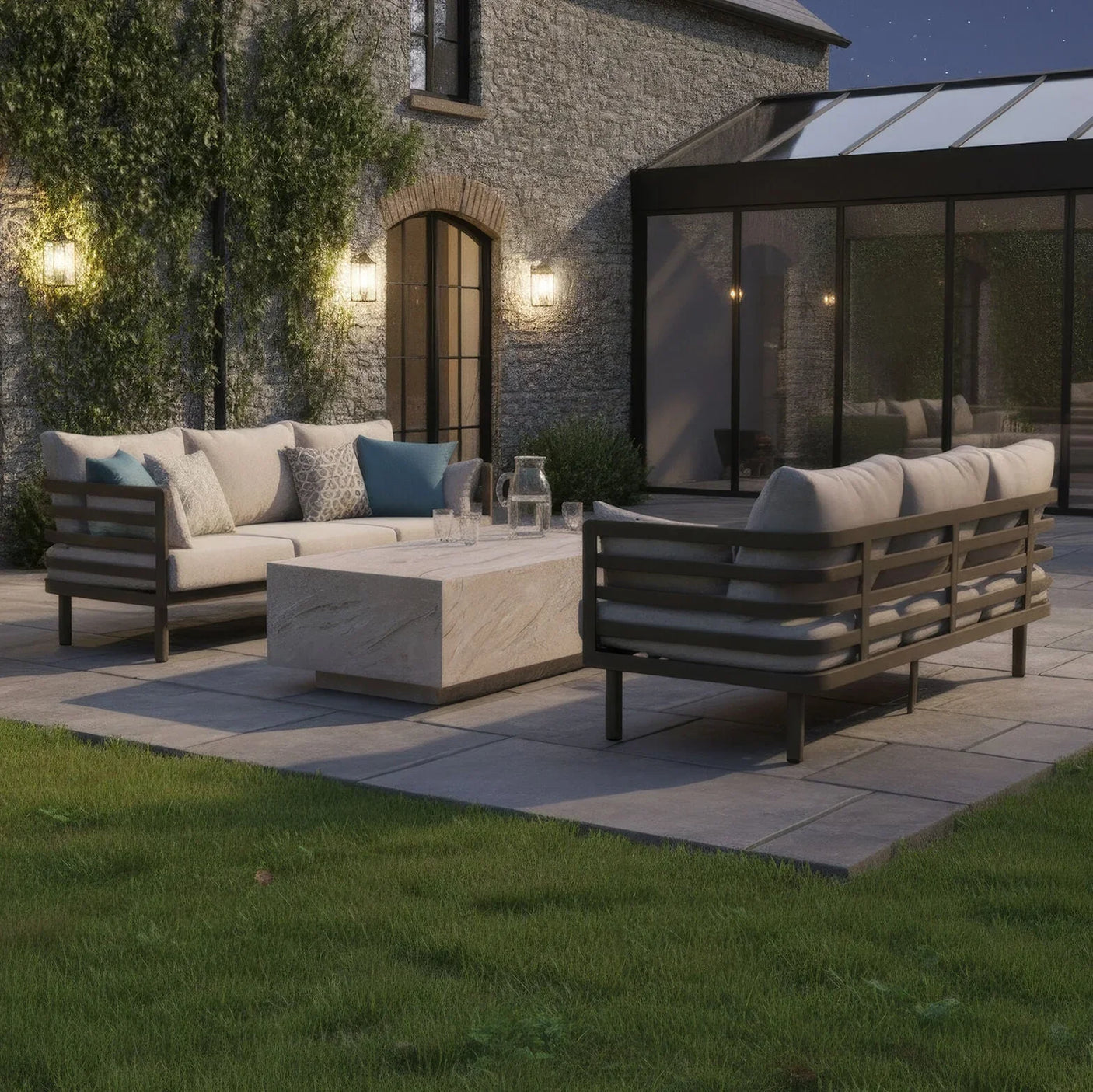 Modern outdoor sofa set with beige cushions and stone coffee table on a patio