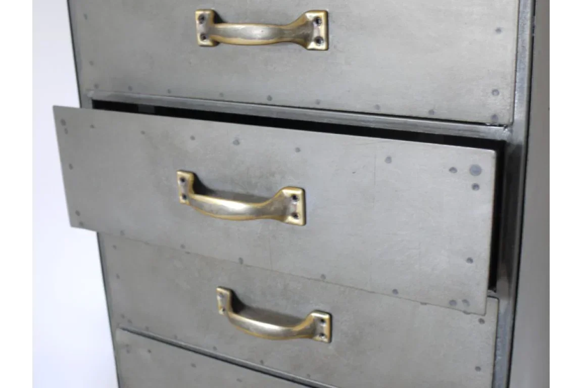 Industrial storage chest with metal drawers and brass handles, close-up front view