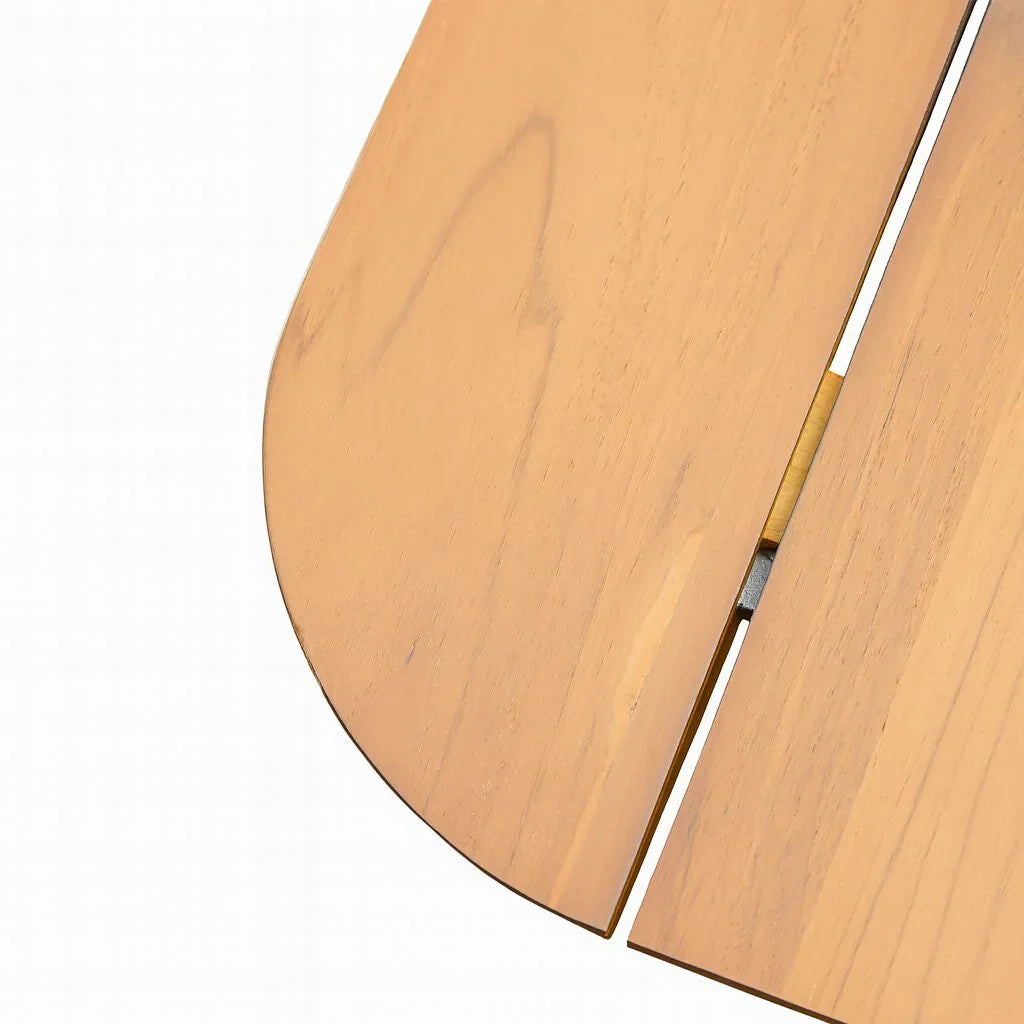 Close-up of wooden dining table corner with natural wood grain and extension leaf gap