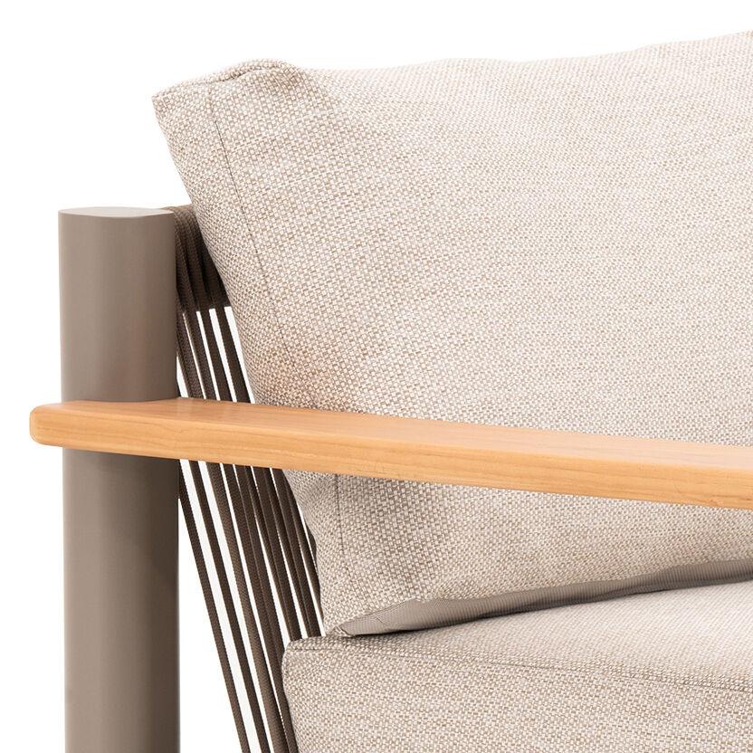 Close-up of beige fabric armchair with light wood armrest and metal frame