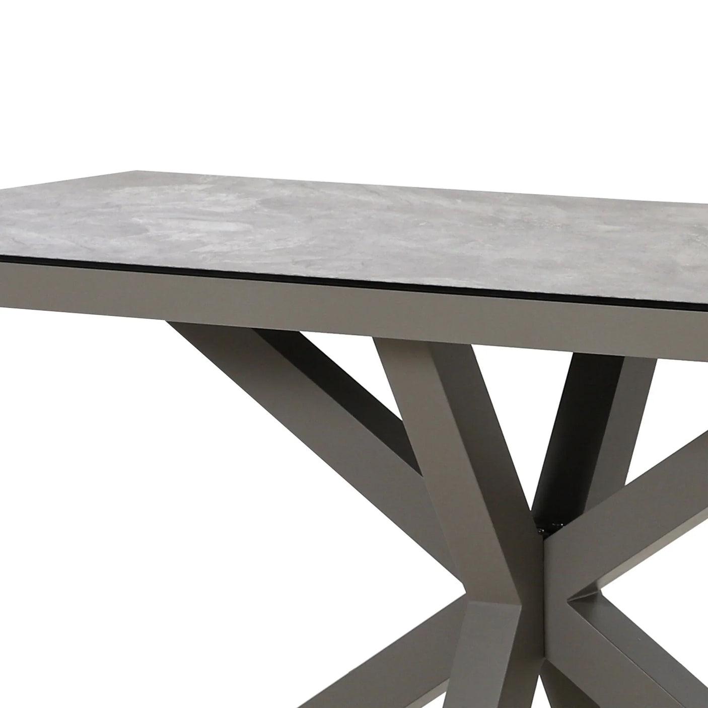 Modern dining table with grey ceramic top and geometric metal base, corner side view