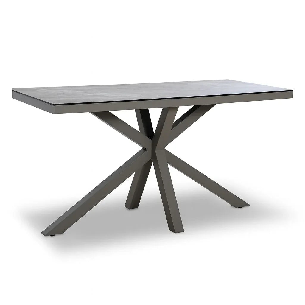 Modern dining table with rectangular grey top and black angled metal legs
